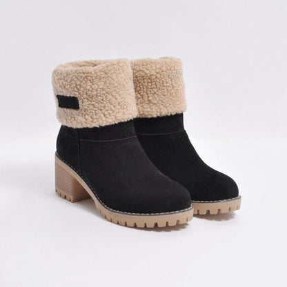 Schwarze Damen-Winterstiefel mit beigem Kunstfell, Blockabsatz, rutschfeste Sohle.