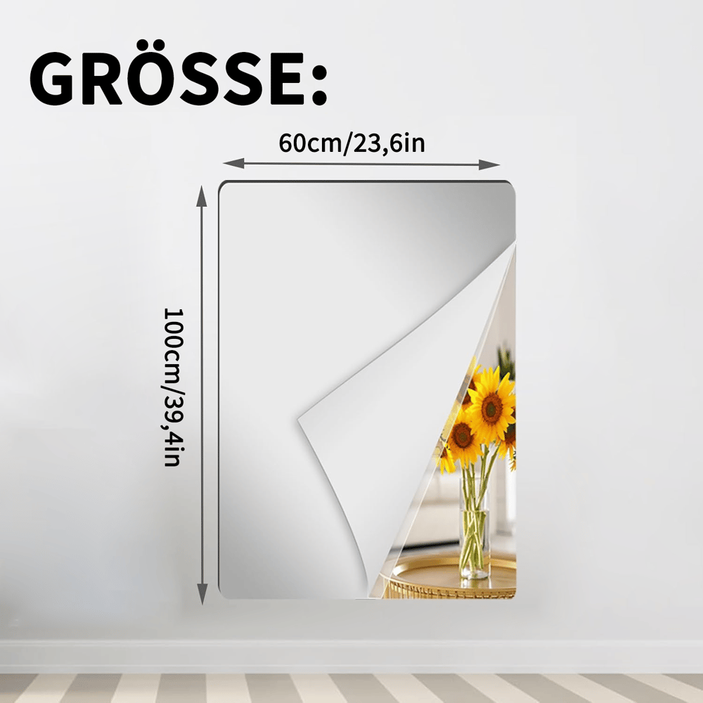 Rechteckige Spiegelfolie an einer weißen Wand mit abgelöster Ecke, Maßangaben 60 mal 100 Zentimeter, im Spiegel eine Vase mit Sonnenblumen. 14
