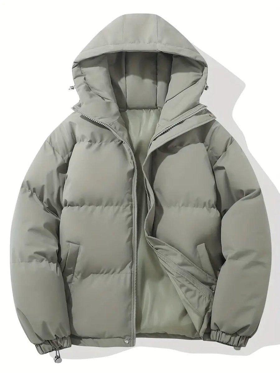 Graugrüne Steppjacke mit Kapuze und hellgrünem Innenfutter, teilweise geöffneter Reißverschluss, flach ausgelegt 6